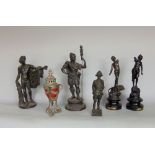 A collection of classical spelter figures of Romanic form together with a further spelter figure