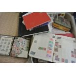 An old suitcase containing a large quantity of stamps, albums, etc