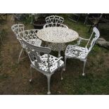 A cream painted cast iron three piece garden terrace set comprising table of circular form with