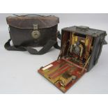 Quarter plate press camera in leather case with four double sided plate holders