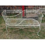 A good quality contemporary steel framed and wire work love seat with scrolled supports united by an