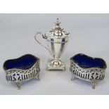 A pair of late Victorian silver salts, with wavy blue glass liners, with pierced decoration of