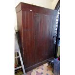 A vintage rustic stained pine side cupboard of tongue and groove boarded construction, floorstanding