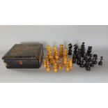 An ebony and boxwood part chess set in the manner of Calvert in a Japanese lacquered box