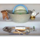 A galvanized baby bath together with a collection of enamel wares and kitchenalia and others