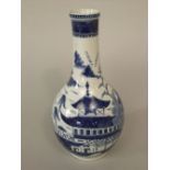 An oriental blue and white vase with pagoda detail, 26cm tall approx