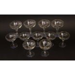 A collection of eleven Babycham glasses, 11 cm high