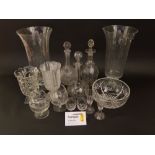 A large collection of glass to include rummers etched with hunting scenes, decanters, vases, etc