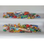 A box containing a collection of vintage die cast toys to include Corgi, Dinky and others