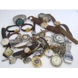 A box containing a quantity of vintage time pieces to include a silver pocket watch on chain, a