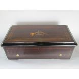 A 19th century Nicole Freres rosewood and box wood inlaid music box, the hinged lid decorated with a