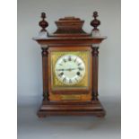 A continental oak cased two train mantle clock, the gilt brass dial signed TP Wright of Holloway