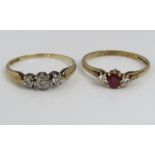 A 9ct diamond and ruby set ring, together with a further 9ct three stone diamond ring, both size