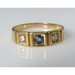 An 18ct sapphire and diamond gypsy ring, size N/O, 2.5g