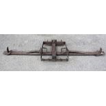 Antique iron man trap, with a single stag antler