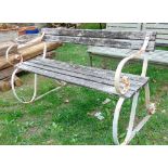 A sprung steel garden bench with timber seat and back