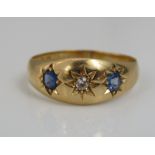 An 18ct sapphire and diamond star set gypsy ring, size Q, 4g