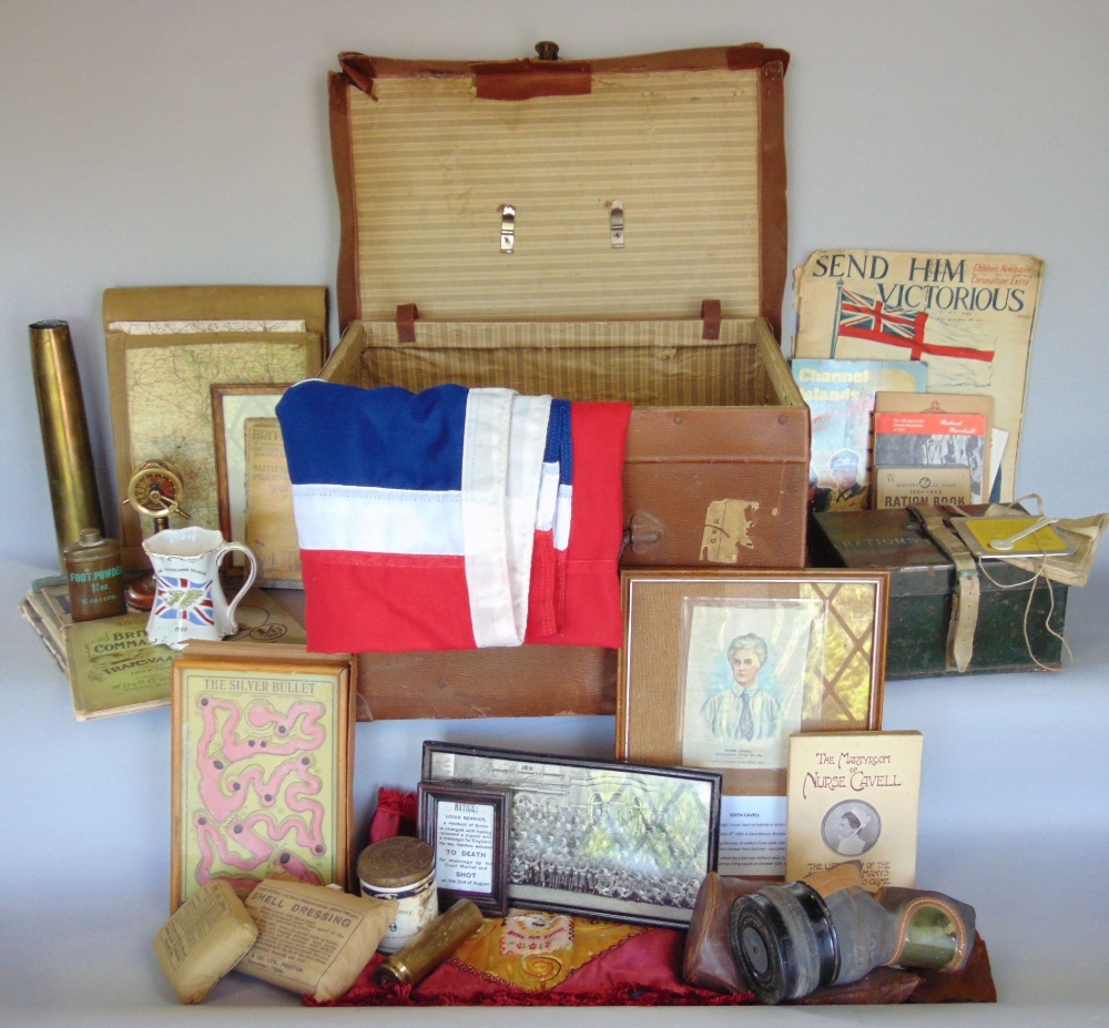 A large collection of military related items to include trench art, flags, books, literature and