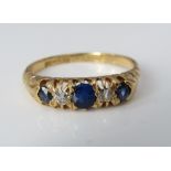 An 18ct sapphire and diamond ring, size M, 3.1g