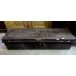 A japanned tin military officers uniform trunk of elongated rectangular form with hinged lid, side