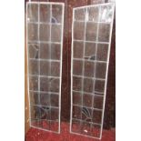 A pair of Art Deco leaded light window panels, partially coloured, each panel 100 x 30 cm approx