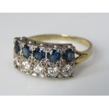A diamond and sapphire double row ring in unmarked yellow metal, size N, 3.5g