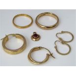 A mixed gold lot to include a 22ct wedding ring and a further 9ct example, various 9ct earrings,