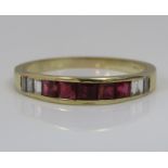 A 14ct channel set diamond and ruby ring, size O, 2.2g