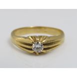 An 18ct diamond solitaire ring in fancy claw setting, the diamond 0.20cts approx, size S, 5.4g