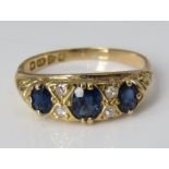 An 18ct sapphire and diamond ring, size O/P, 3.8g