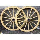 A pair of sound wagon wheels with traditional painted finish, 115cm diameter