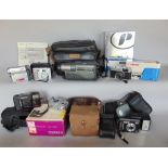 A Sony video camera together with a Hitachi video camera and a collection of various digital and