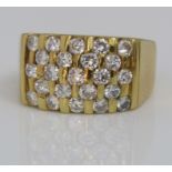 An 18ct diamond set chequerboard type ring set with twenty three diamonds in total, each stone 0.