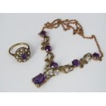 A 9ct amethyst and seed pearl drop necklace of articulated scrolling design, together with a similar