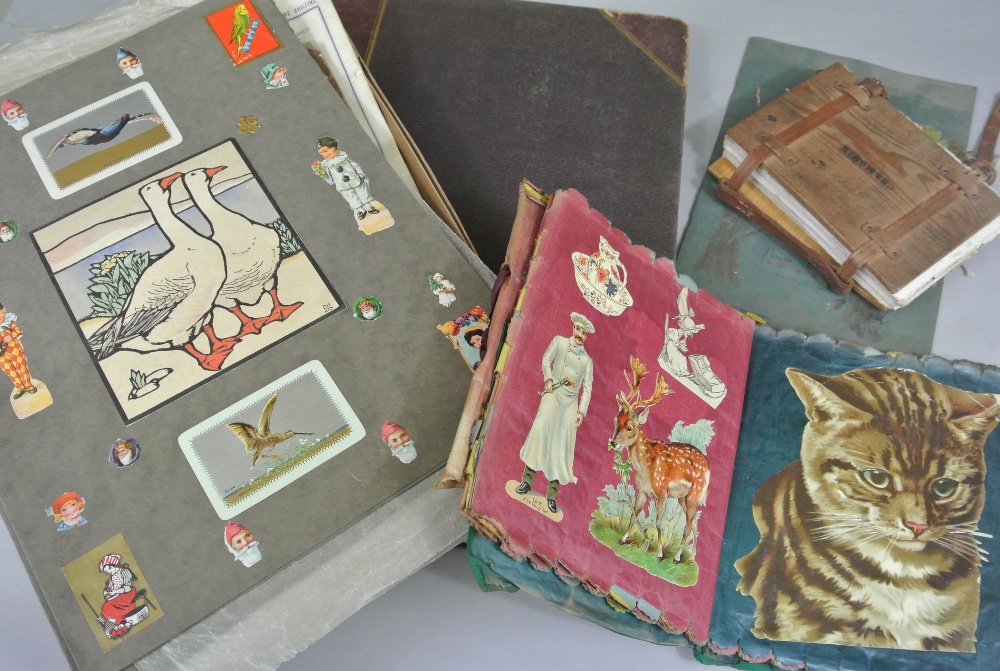 A large scrapbook part filled with cuttings and clippings, etc a box full of loose scrapbook