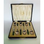 A cased set of 6 art deco silver teaspoons, with green stone handles, marked Birmingham 1923