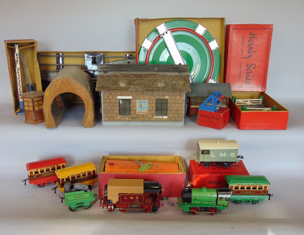 A collection of Hornby tin plate Railwayana to include locomotives, carriages, tracks, building