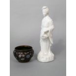 A blanc de chine figure of a female character in oriental style costume, carrying a basket, 26 cm