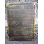 A reclaimed heavy brass ecclesiastical wall mounted plaque with engraved lettering commemorating