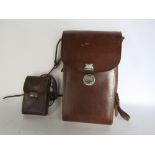 Kodac No 3A folding pocket camera within a leather carry case, together with a further vest pocket