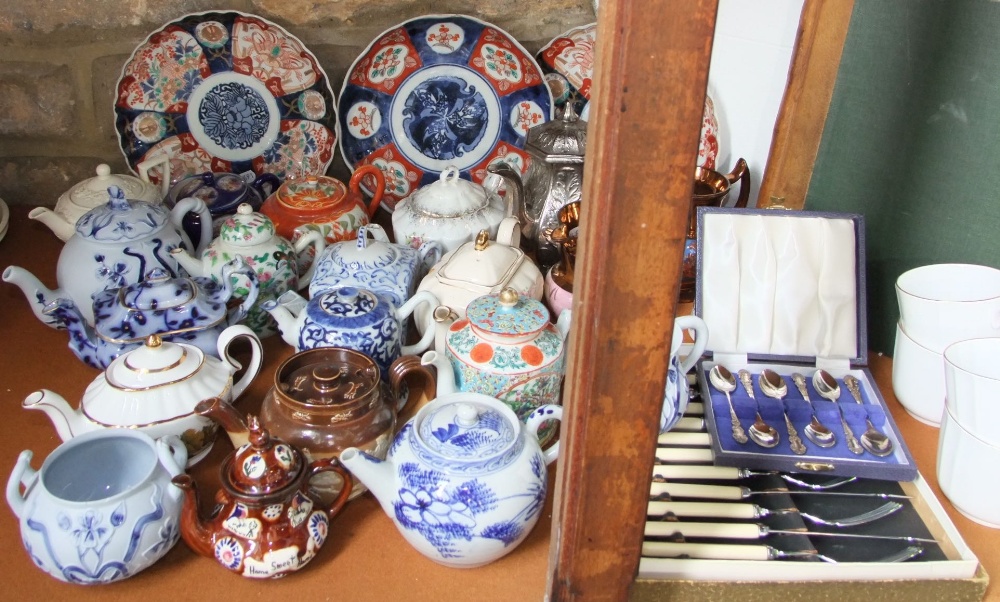 A collection of oriental and other teapots including a blue and white example, famille rose example, - Image 2 of 3