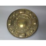 Antique embossed copper alms dish, with flowers and flutes, dated 1707, 48cm diameter