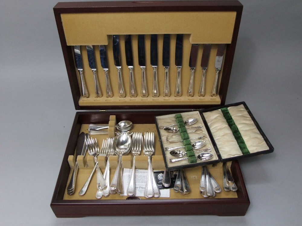 Teak cased canteen of various silver plated beaded flatware together with a further part fitted