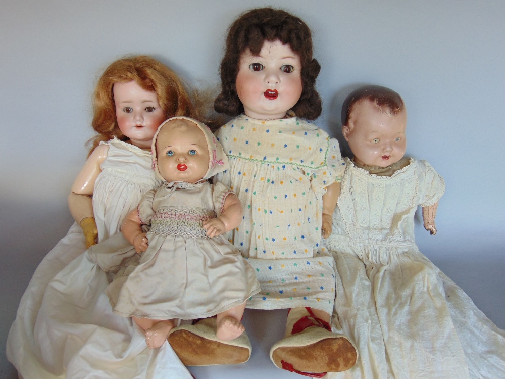 Three antique wooden dolls to include Simon and Hallig doll, further Heubach and Koppelsdorf and two