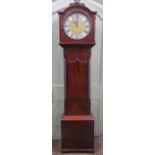 A Regency mahogany longcase clock, the door with lancet shaped outline, enclosing a circular dial