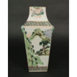 A 19th century oriental famille vert vase of four sided form with alternating landscape and