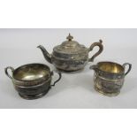 1920s ovoid silver teapot, milk jug and sucrier, with embossed band (3)