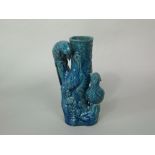 An unusual blue glazed vase with applied figures of pheasant in the oriental manner 25.5cm tall