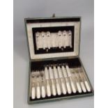 A leather cased canteen of fancy pearl handled flatware to include six knives and forks, together