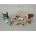 A collection of ceramic animals including a Beswick donkey, a German green glazed model of a foal,